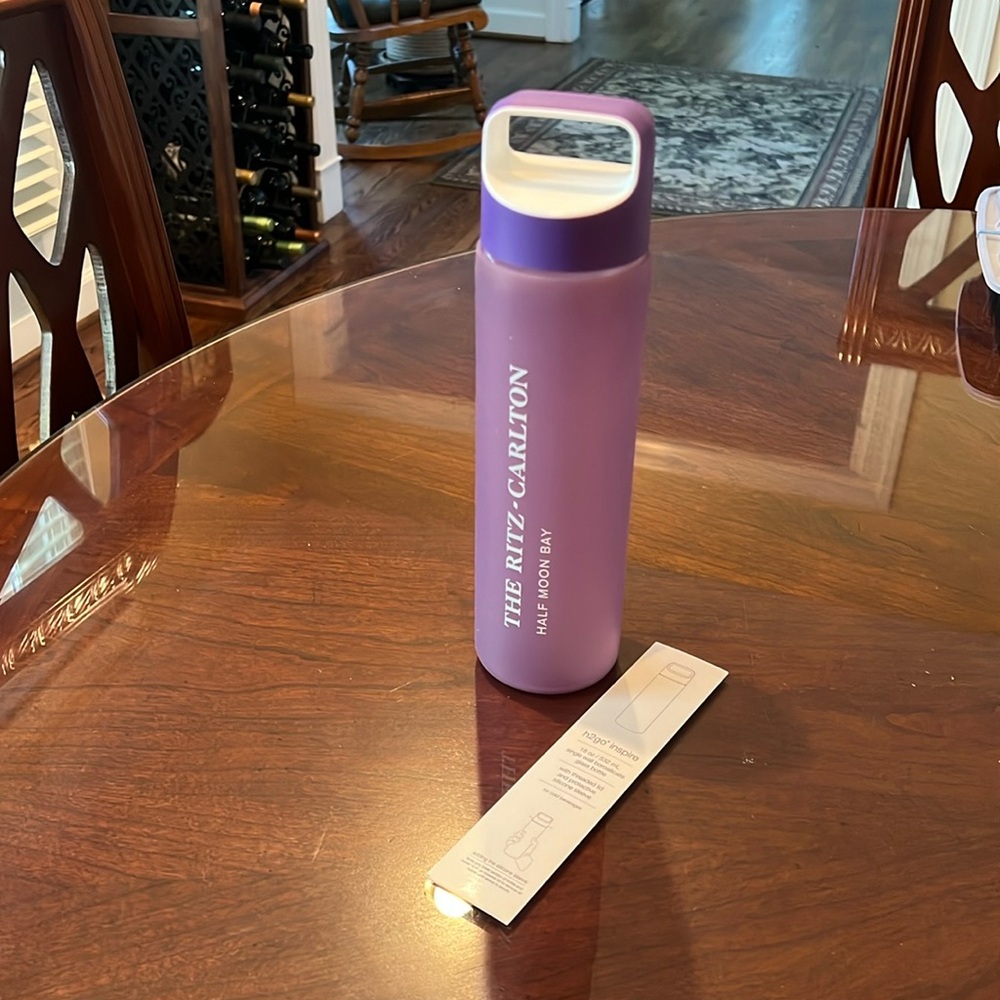 Glass water bottle. Purple